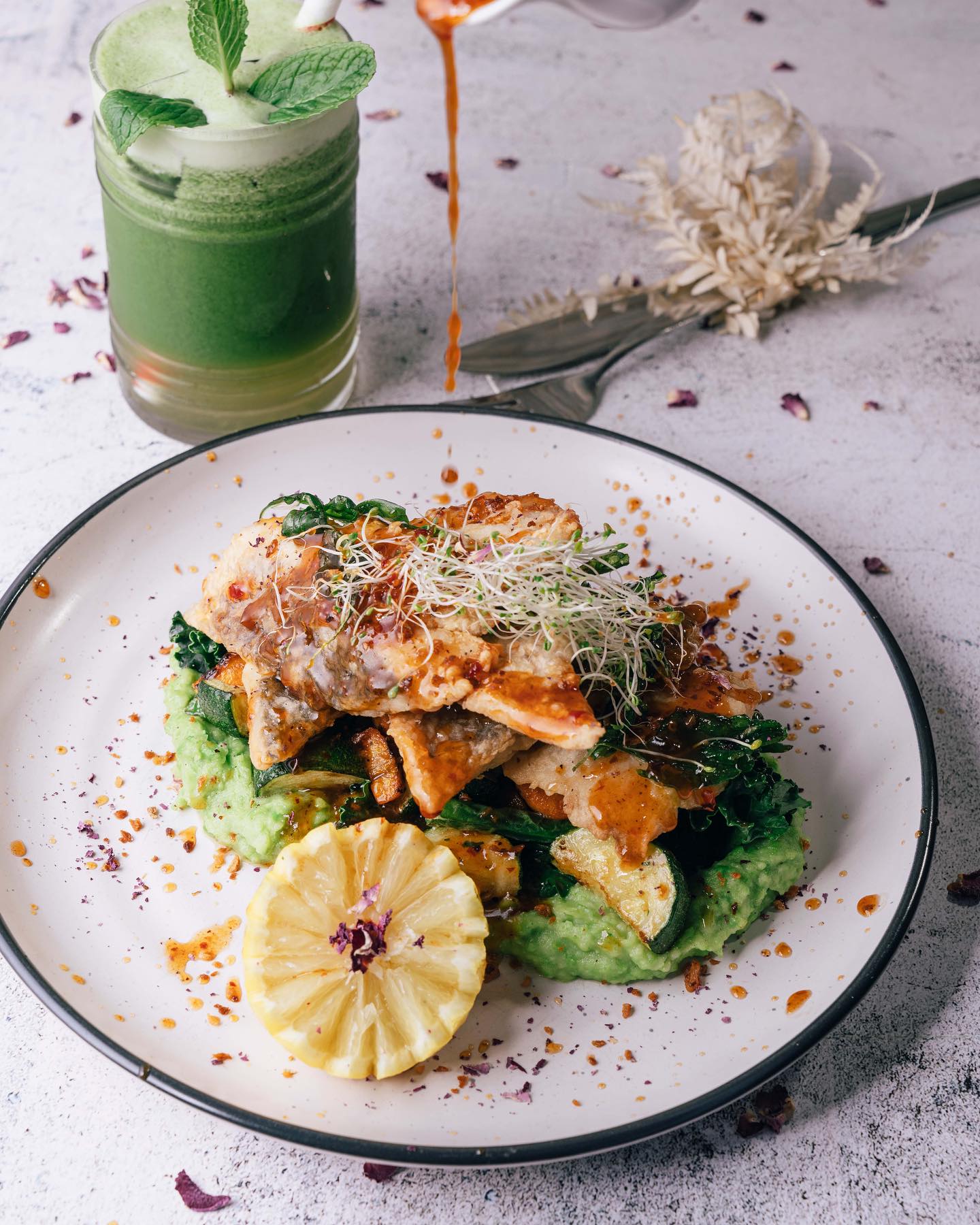A plated dish and green drink shared by The Fox Cafe in October 2023